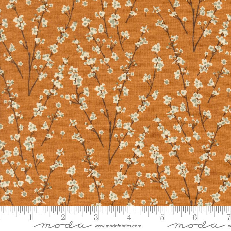 White floral branches on orange background