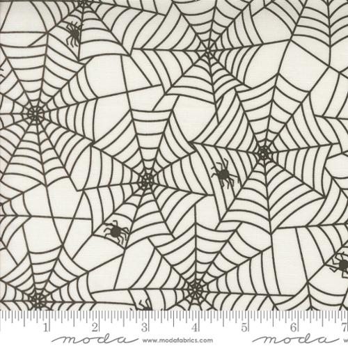 black spider webs with small black spiders on white background