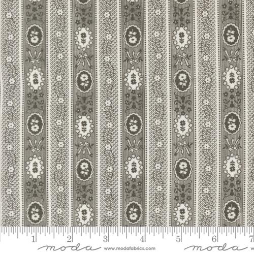 Patterned fabric with vertical stripes featuring floral designs, branded 'Moda Fabrics'.