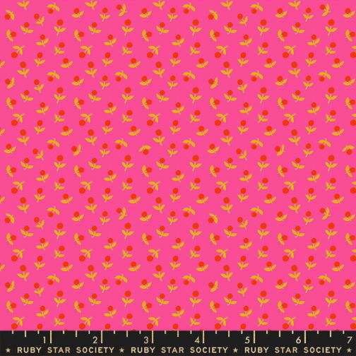 Fabric with small red and yellow floral pattern on pink background, Ruby Star Society label at bottom.