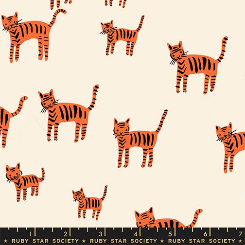 Striped orange cats on a beige background with a ruler at the bottom