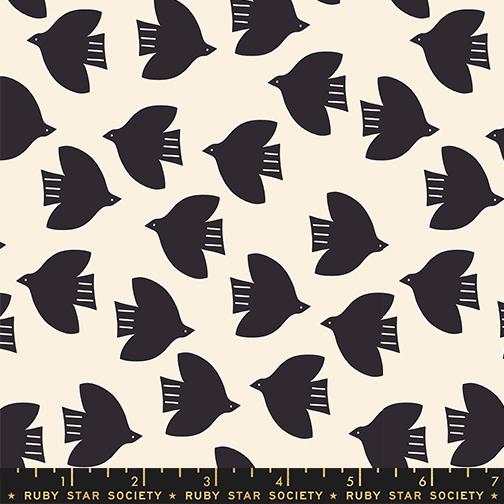 Pattern of black birds on a beige background with a ruler at the bottom.