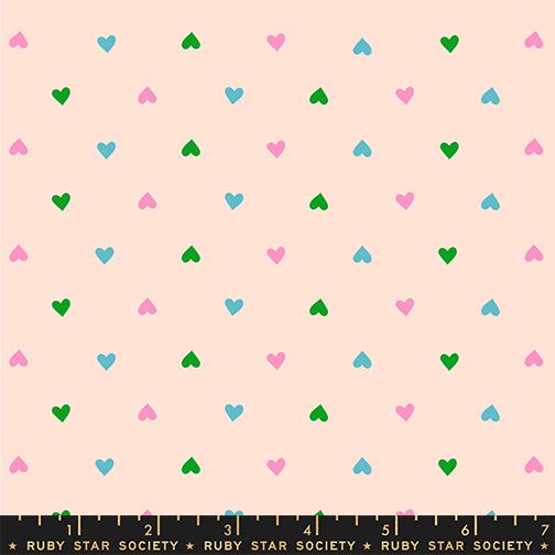 Multicolored heart pattern on a light pink background with Ruby Star Society label
