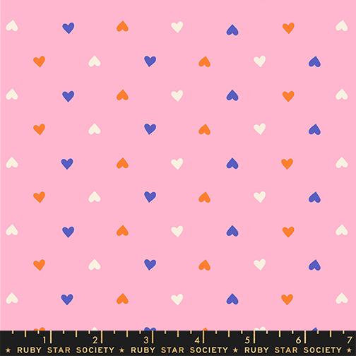 Pink fabric with colorful heart pattern and Ruby Star Society label