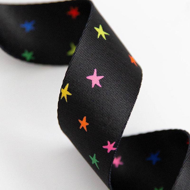 Black webbing with colorful little stars