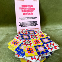 Stack of colorful quilt-style sticker patches with a pink information card on a green background. A pink card is placed behind with instructions for use.