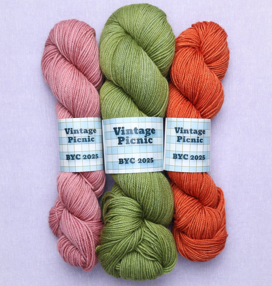 Three skeins of vintage picnic yarn: cupcake, touch grass, carrot cake