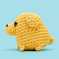 Side view of a yellow crocheted dog