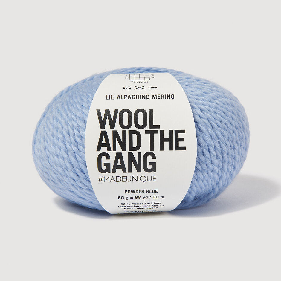 Blue yarn ball with 'Wool and the Gang' label on a white background
