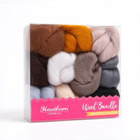Picture of the wool bundle box containing roving in withe, orange, gray, and brown tints.