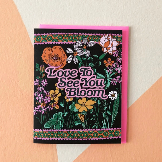 Black card with 'Love to See You Bloom' in pink with wild flowers surrounding