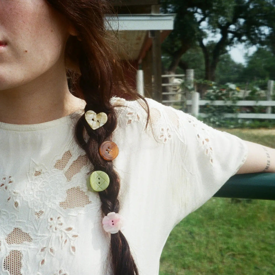 Lady with the button hair clips in her braid