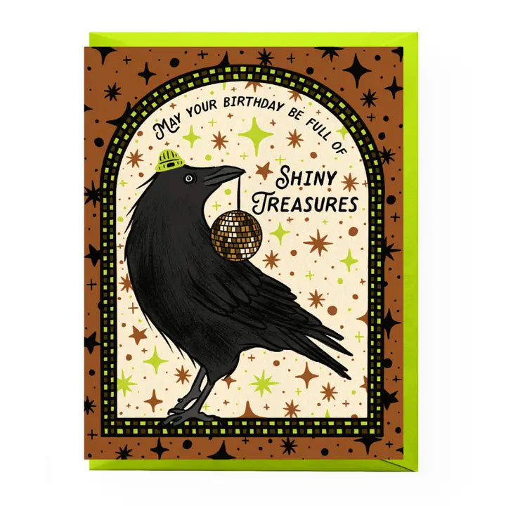 Greeting card with a black crow holding a disco ball and celebratory text on a patterned background.