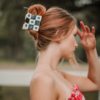 Lady wearing the black and white daisy patchwork hair claw