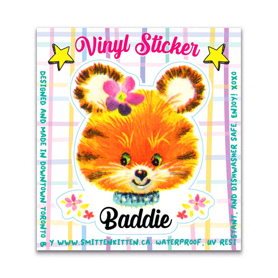 Vinyl sticker of a colorful tiger face with 'Baddie' text on a plaid background