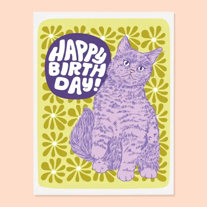 Birthday card with a purple cat illustration and 'Happy Birthday!' text on a yellow floral background.