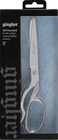 A pair of silver scissors in packaging.