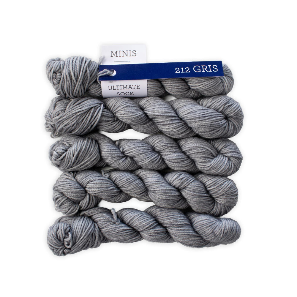 Gray yarn skeins with a label on a white background
