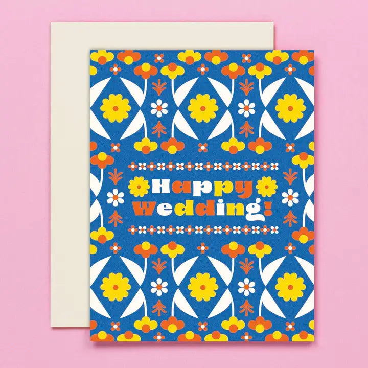 Colorful 'Happy Wedding!' card with floral patterns on a pink background