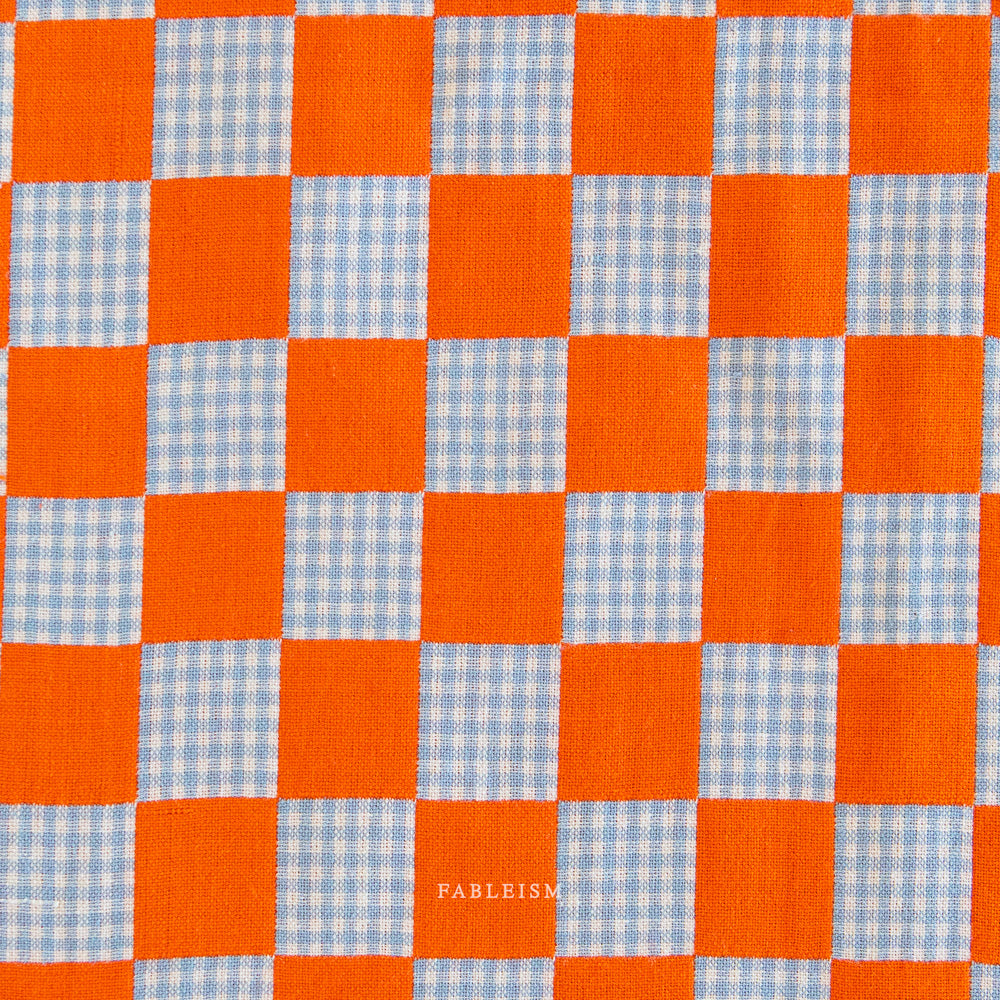 Checkered pattern with orange and blue squares,