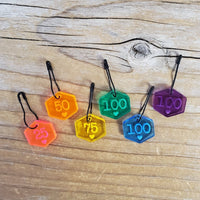 Rainbow stitch markers on pins