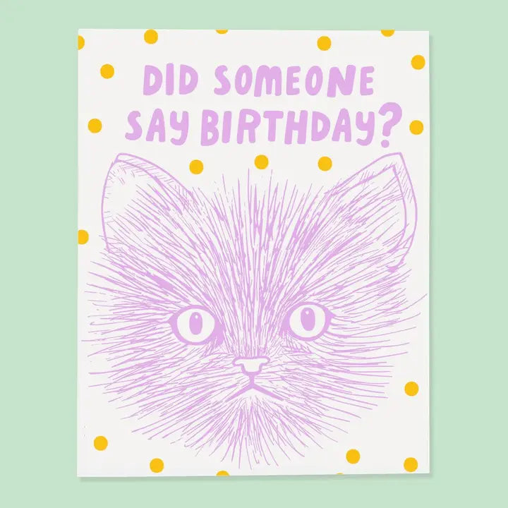 Birthday card with purple cat illustration and text 'Did someone say birthday?' on a light green background.