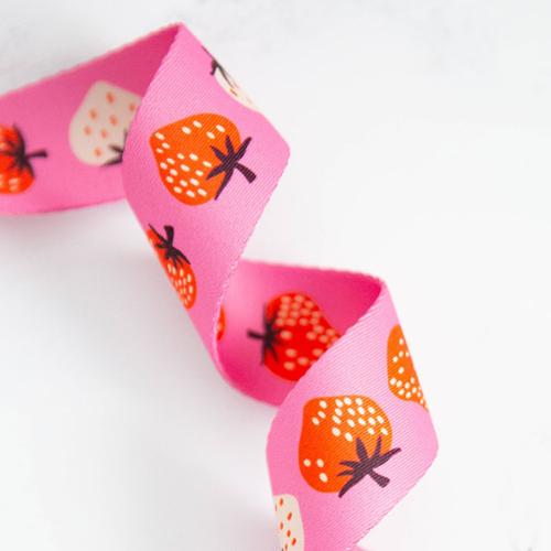 Pink webbing with red and white strawberries