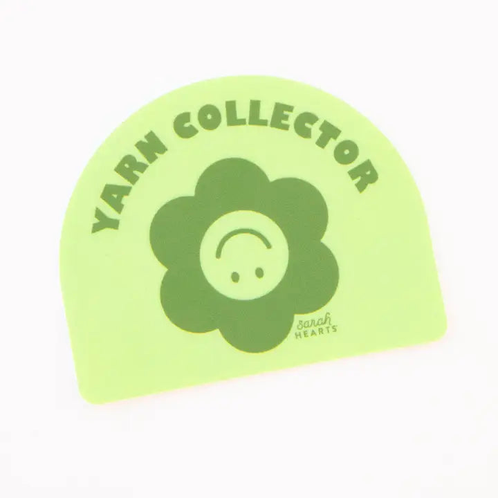 Yellow and green 'Yarn Collector' sticker with a flower design on a white background