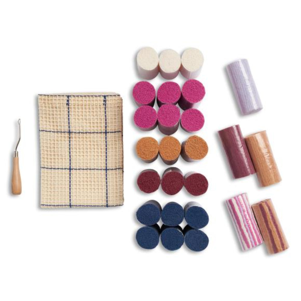 Content of the kit including canvas, latch hook and yarn.