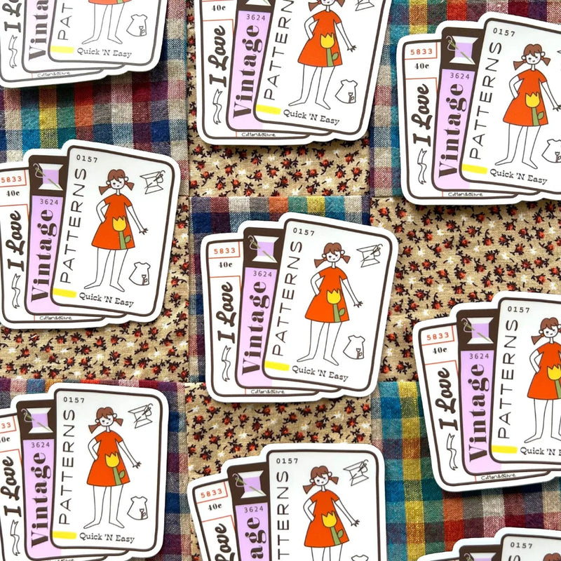Stickers with 'I Love Vintage Patterns' design on a fabric background