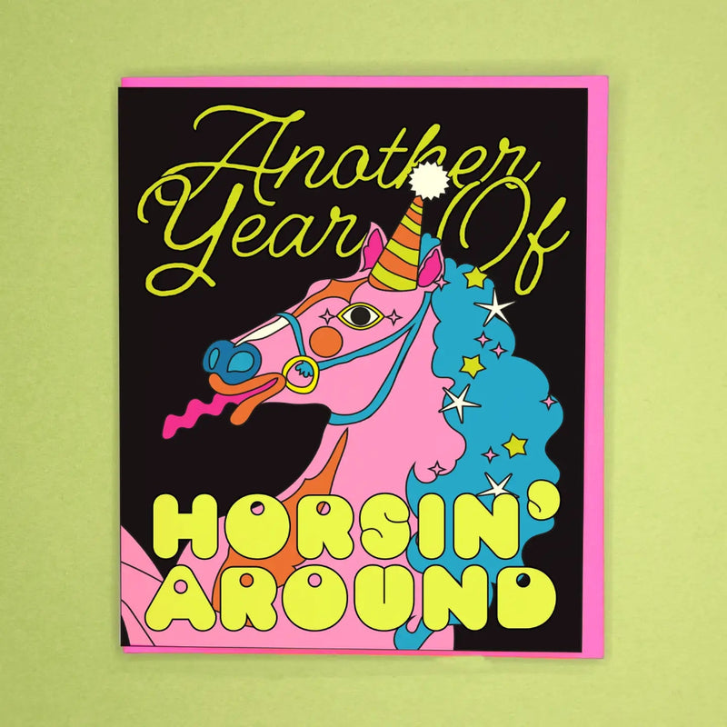 Colorful greeting card with a horse design and text on a green background