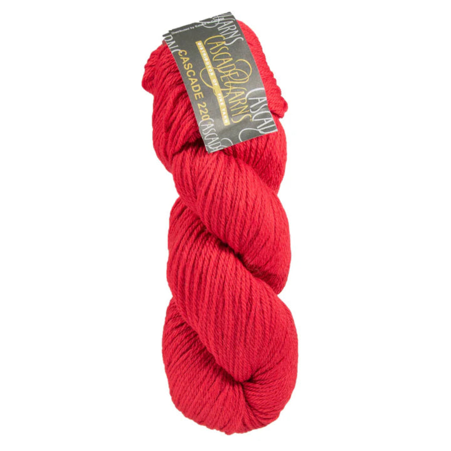 Red skein of yarn with a label on a white background