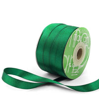 Green ribbon spool with visible brand name on a white background