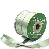 Light reen ribbon spool with visible brand name on a white background