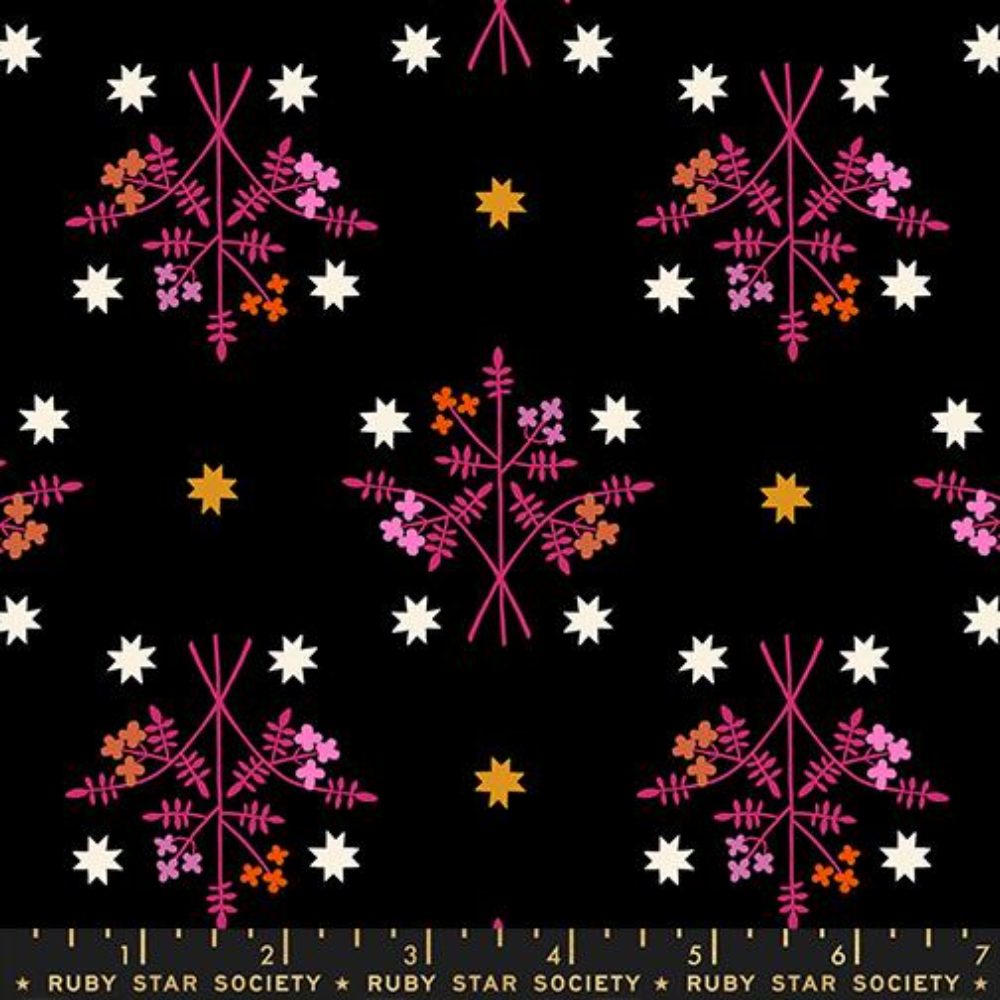 Pink and orange bouquet on a black background with yellow and white stars surrounding.