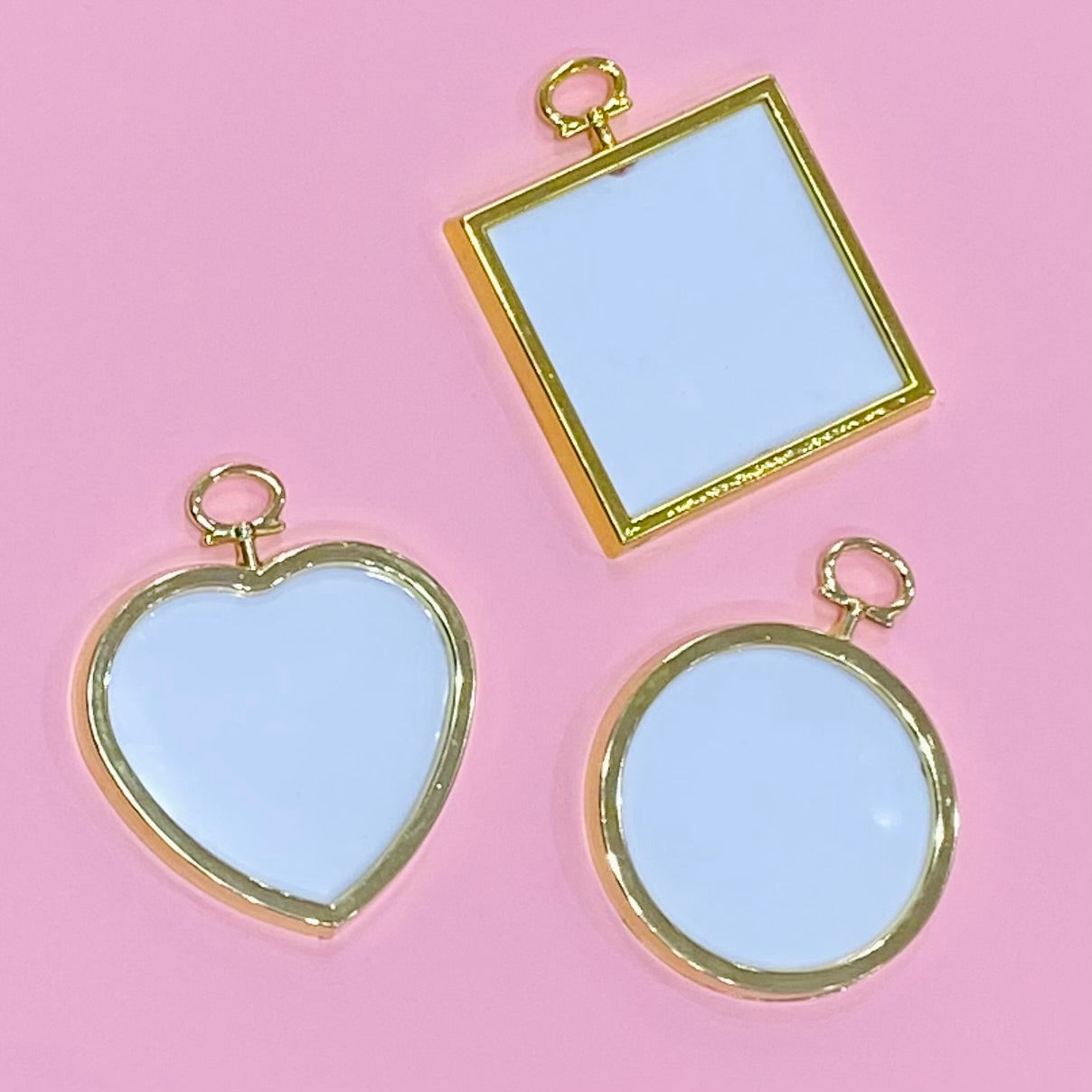 3 gold frames in heart, square, and circle shapes  