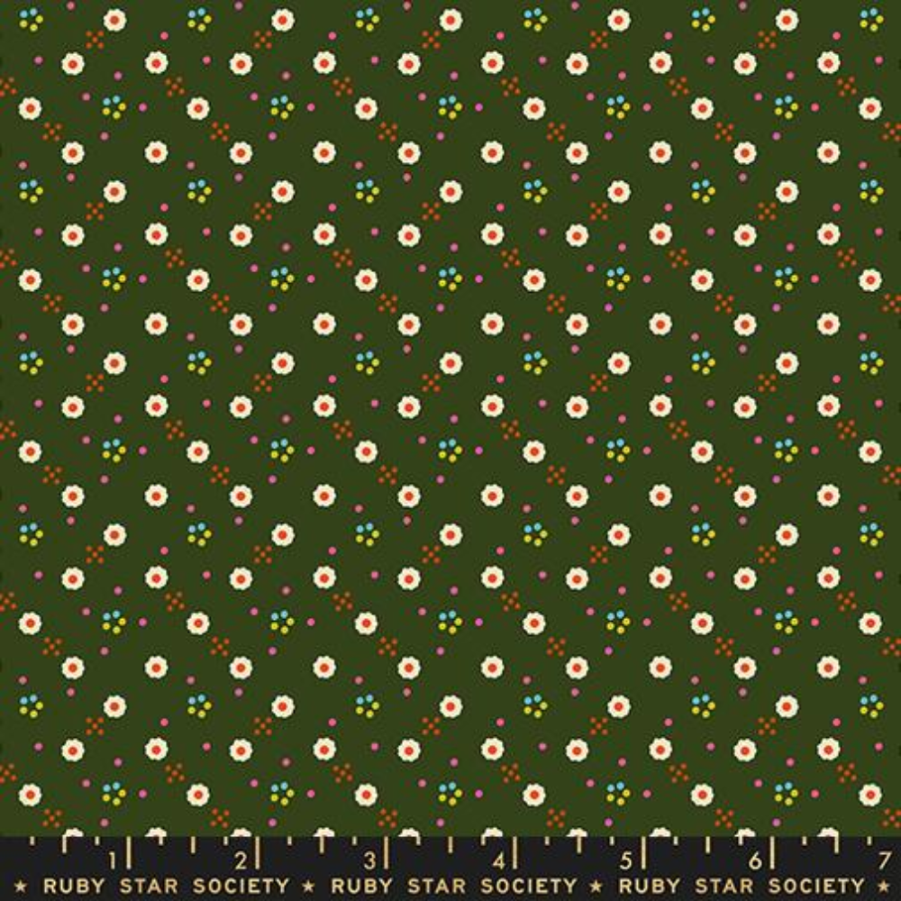 White daisies spread across a dark green background with little orange and blue dots surrounding.