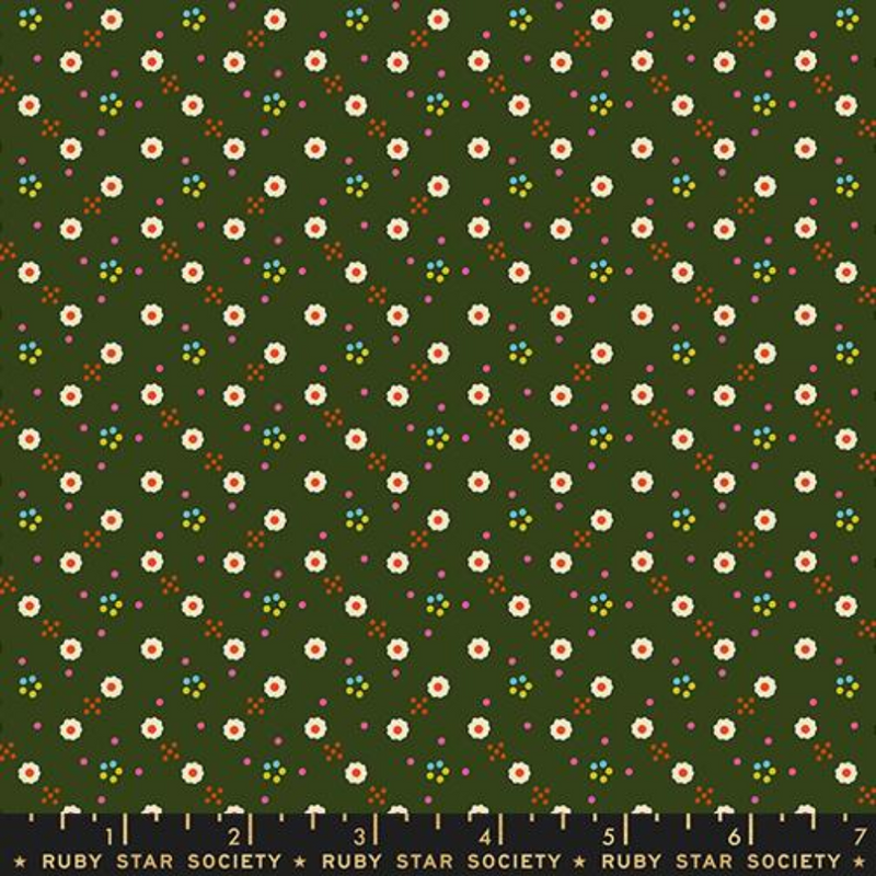 White daisies spread across a dark green background with little orange and blue dots surrounding.