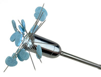 Metallic tool with blue pins on a white background