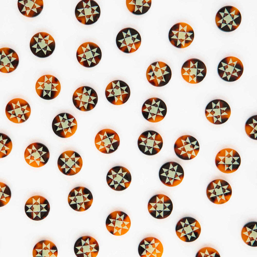 Pattern of geometrically shaped stickers on a white background