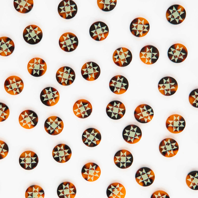 Pattern of geometrically shaped stickers on a white background
