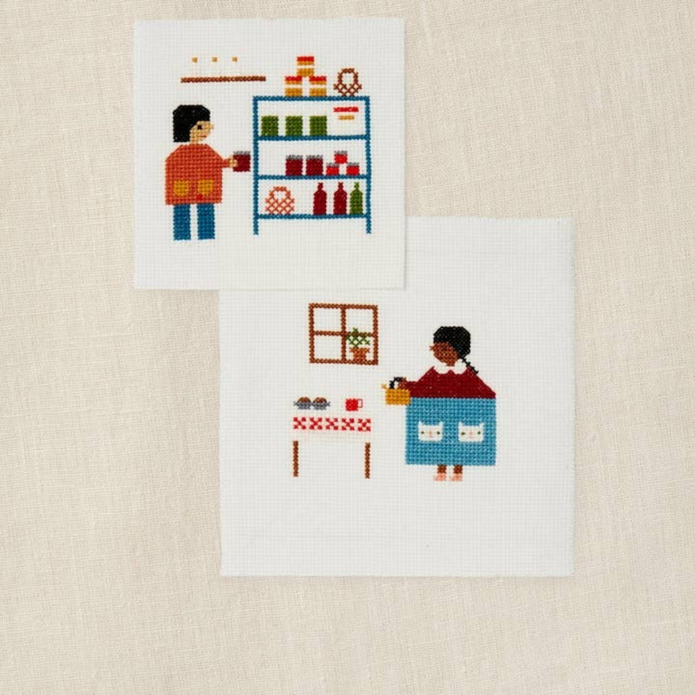 Two cross-stitched scenes on fabric, one with a person at a shelf and the other with a child by a table.