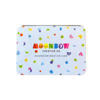 Colorful tin with 'Moonbow Creative Co.' branding on a white background