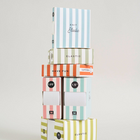A stack of five Knit Elastic boxes in various colors and stripe patterns, arranged vertically on a light gray background.
