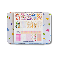 Colorful patterned paper set in a tin with visible brand name.