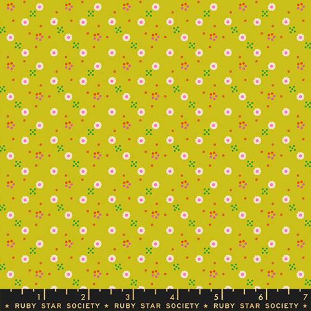 White daisies spread across a chartreuse background with little orange and green dots surrounding.