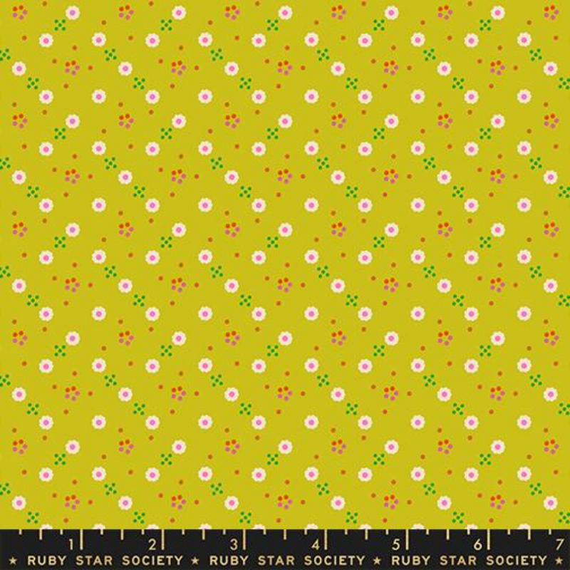 White daisies spread across a chartreuse background with little orange and green dots surrounding.