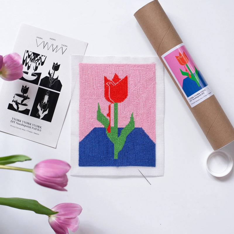 Needlepoint kit with red tulip on pink and blue background