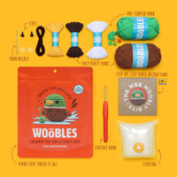 Crochet kit with yarn, hooks, and instructions on a yellow background