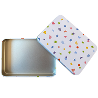 Metallic tin with a colorful patterned lid on a white background
